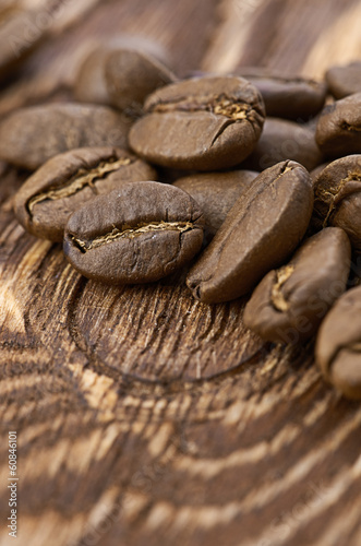 Coffee beans on wood background