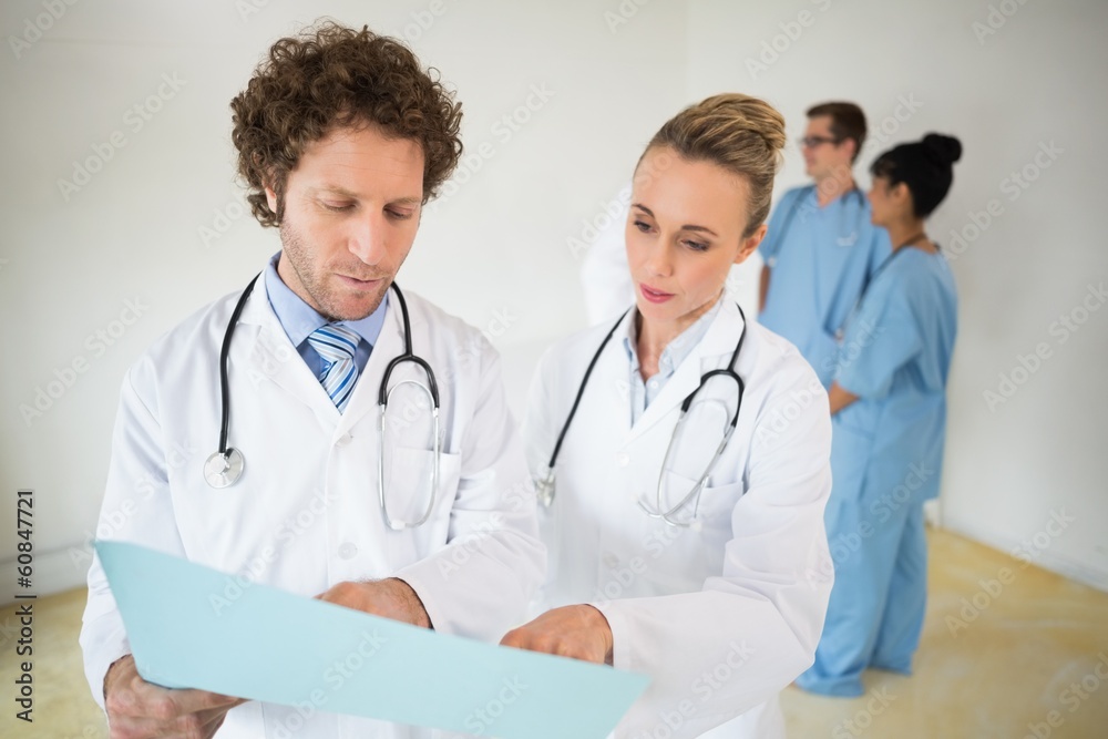 Doctors reading file Doctors reading file