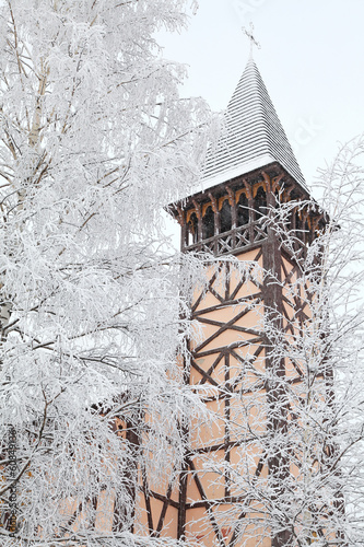 Old church tower and winter trees, Stary Smokovec - Slovakia photo