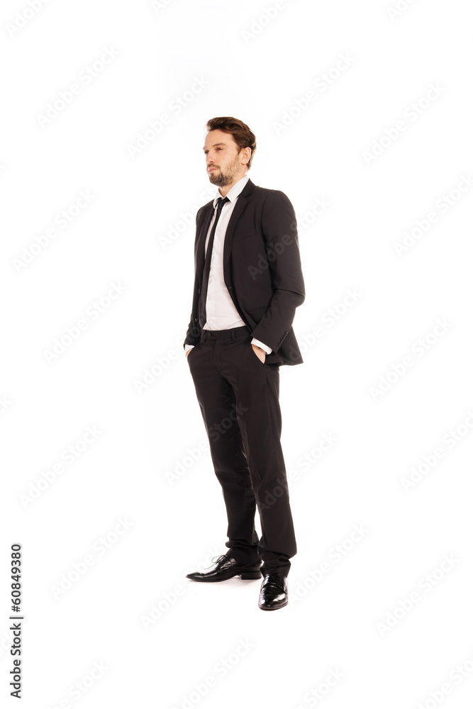 Stylish young businessman standing thinking Stylish young businessman standing thinking
