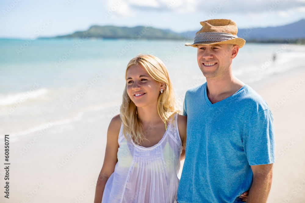 Caucasian couple lovers on beach walking
