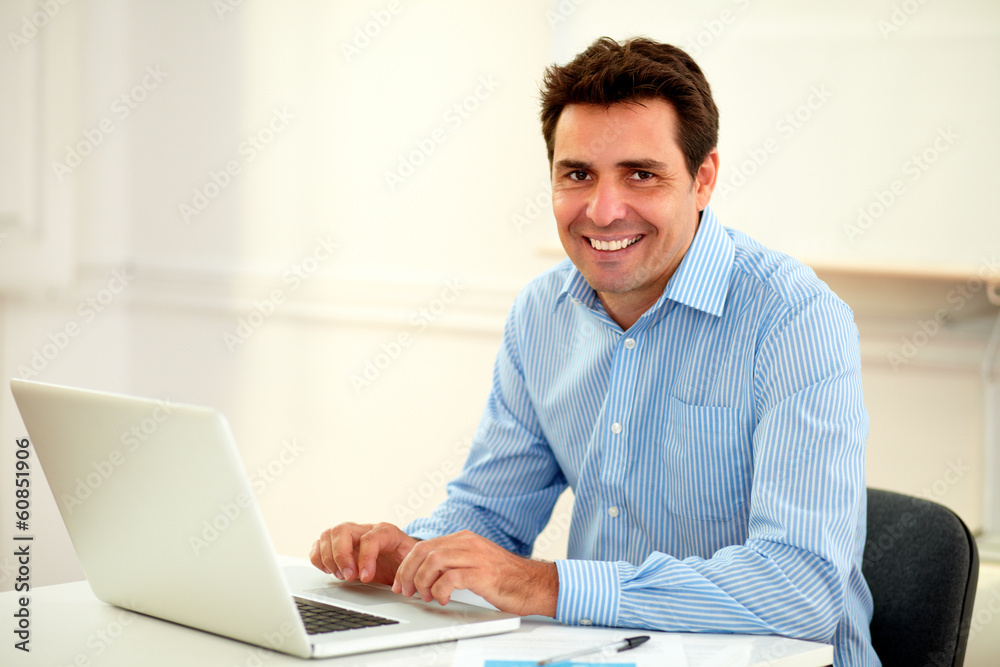 Handsome latin businessman smiling at you Handsome latin businessman smiling at you
