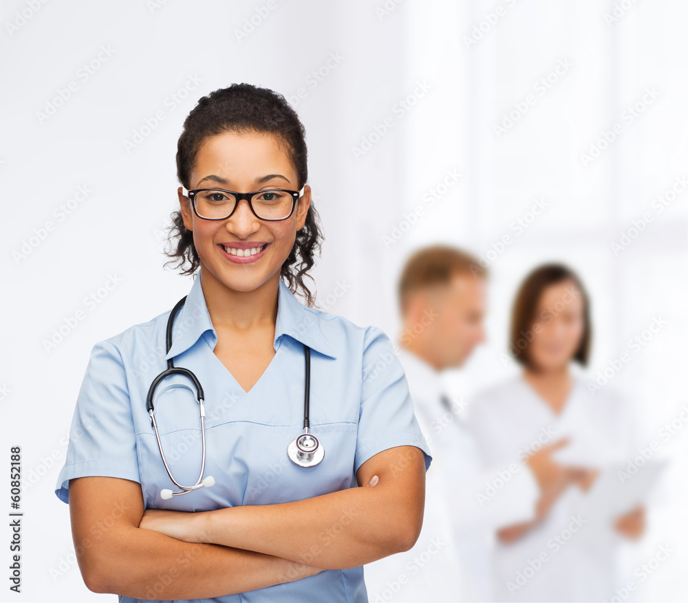 smiling female african american doctor or nurse smiling female african american doctor or nurse
