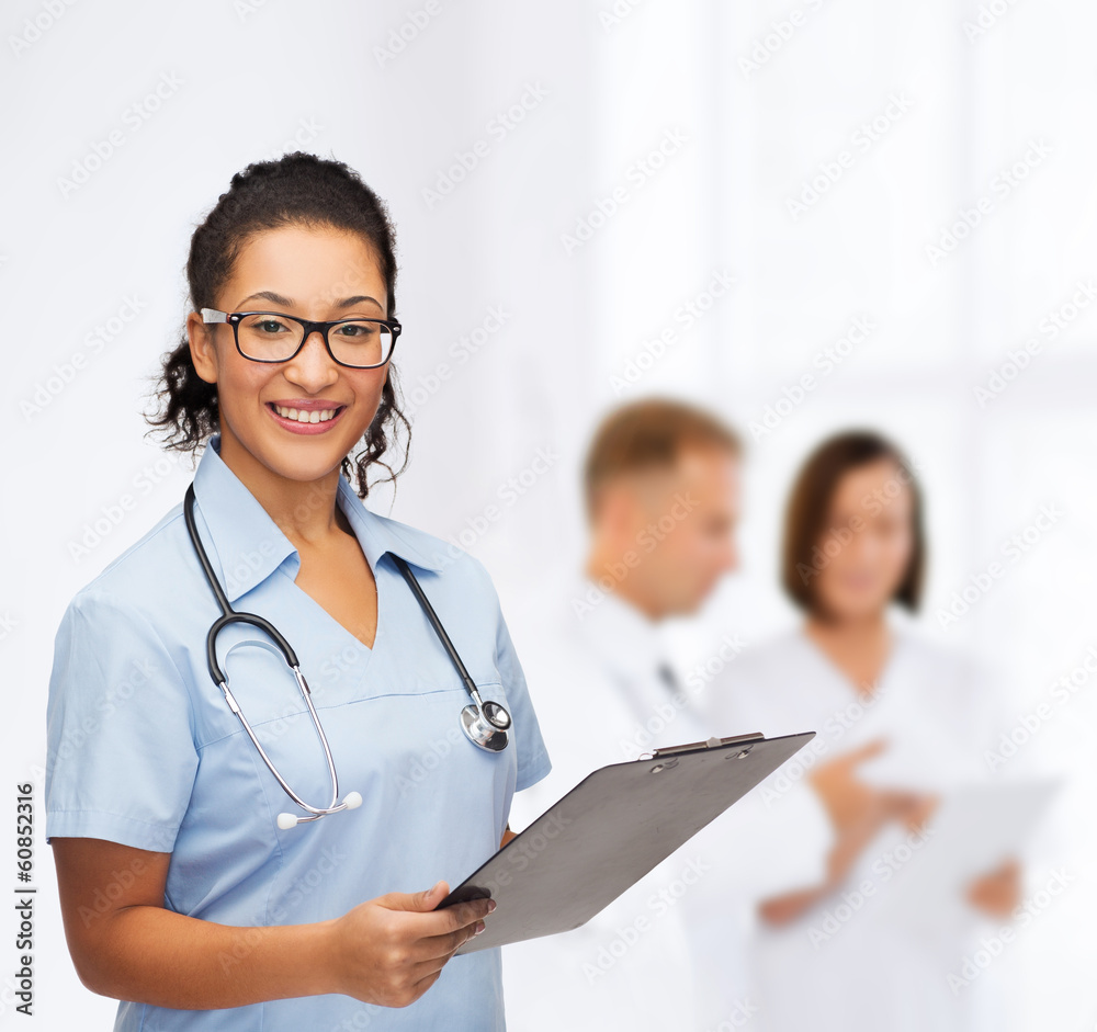 smiling female african american doctor or nurse smiling female african american doctor or nurse