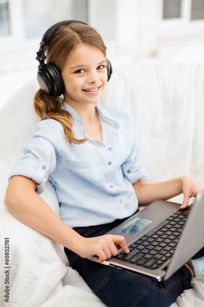 girl with laptop computer and headphones at home girl with laptop computer and headphones at home