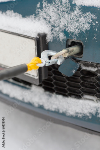 closeup of towed car with towing rope photo