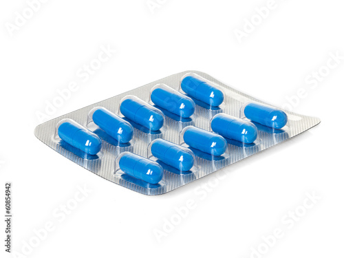 Valokuvatapetti Blue medication capsules in blister pack close-up