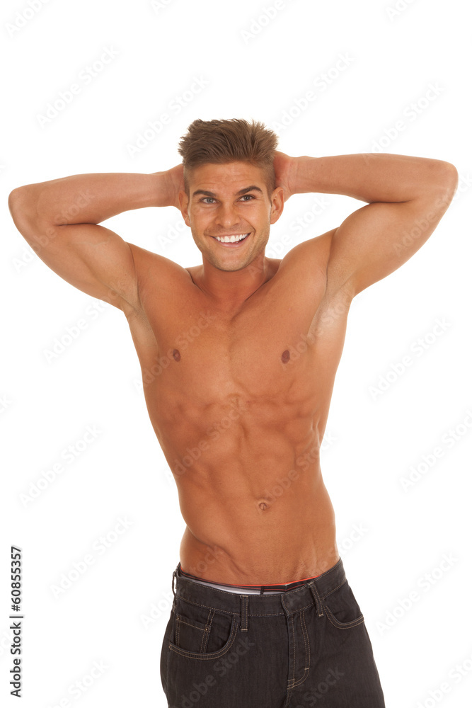 strong man hands behind head no shirt smile