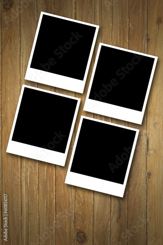 Blank photos over Wood background..