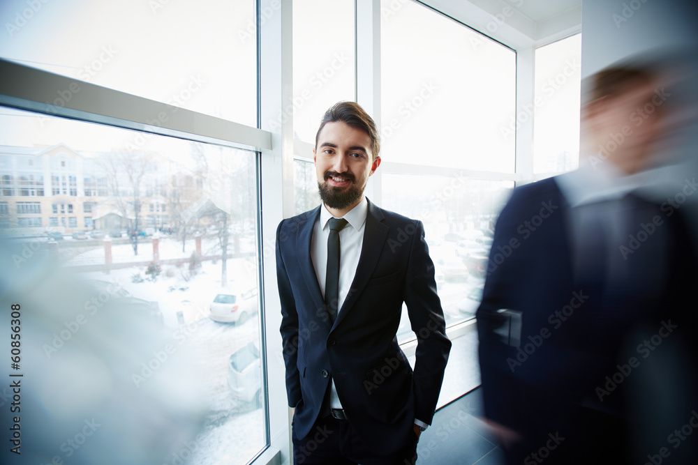 Businessman by the window Businessman by the window