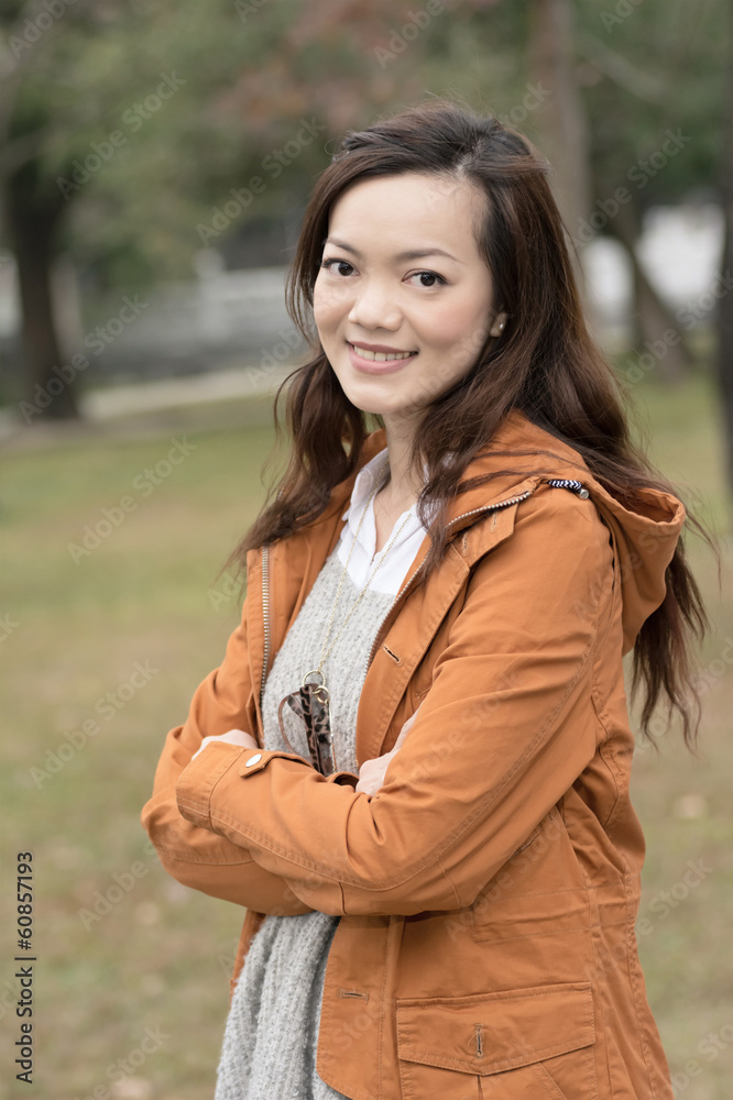 Happy smiling Asian young woman in the park Happy smiling Asian young woman in the park