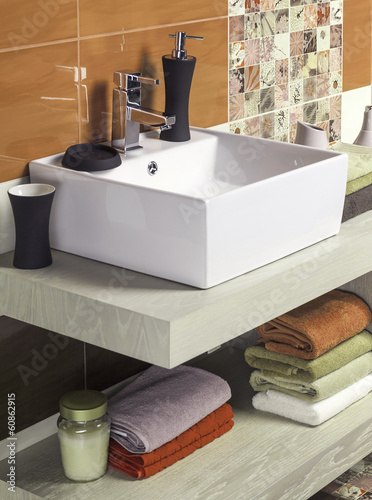 Interior of modern bathroom with sink and toilet