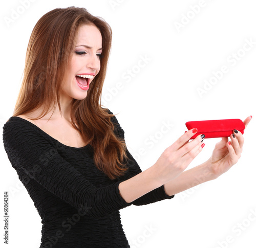 Girl looks at box with jewe...