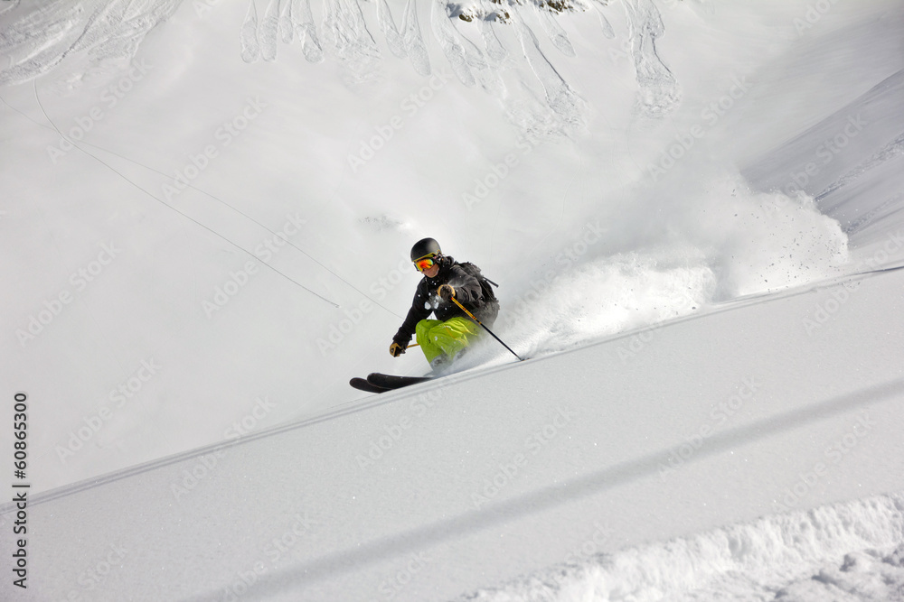 Skier in deep powder, extreme freeride Skier in deep powder, extreme freeride