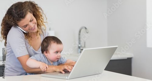 Young woman multi tasking at home