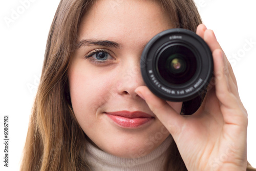 portrait of beautiful girl with the lens near the eye