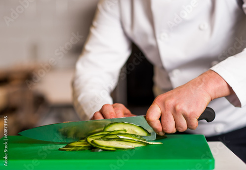 Chef chopping leek, doing preparations