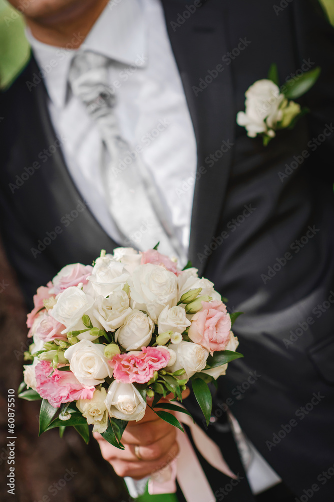 groom with flowers groom with flowers