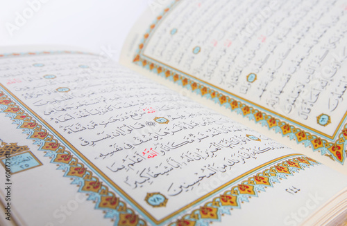 The Holy Quran over white background