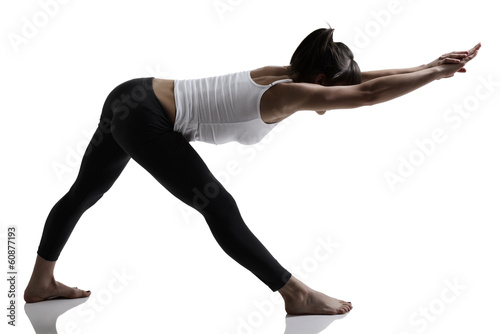 portrait of sport girl doing yoga stretching exercise, studio sh