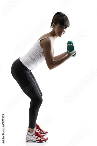 sport girl doing with exercise dumbbells, fitness woman studio s
