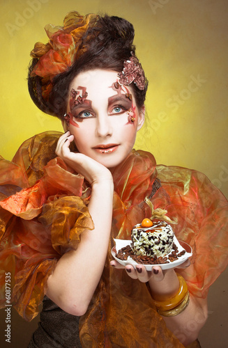 Young woman with cake photo