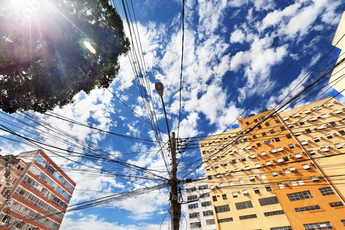 View from below of electrical lines on power pole in Rio de Jane photo