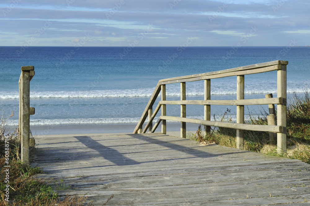 Beautiful wooden gangway to ocean beach in galicia, Spain Beautiful wooden gangway to ocean beach in galicia, Spain