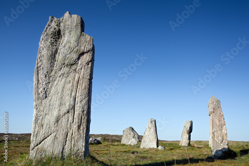 Standing stones against a blue sky