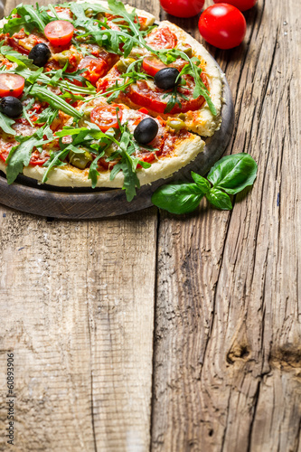 Fresh pizza made ​​of fresh ingredients as background