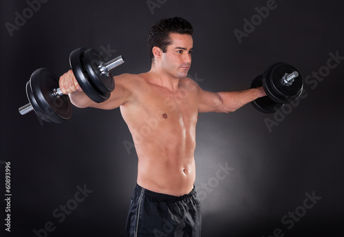 Man Exercising Dumbbells
