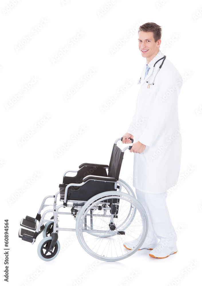 Young Male Doctor Pushing Wheelchair Young Male Doctor Pushing Wheelchair