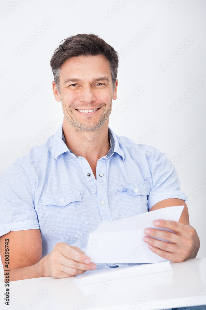 Mature Man Reading Letter