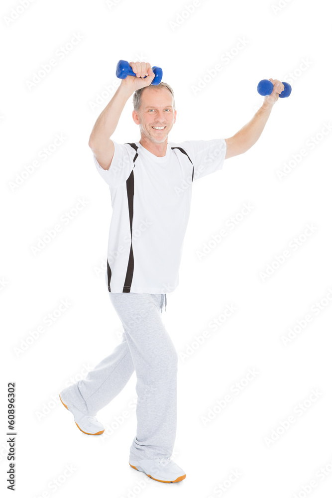 Mature Man Exercising With Dumbbells Mature Man Exercising With Dumbbells