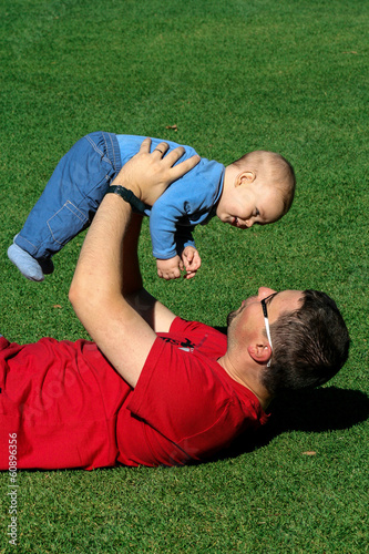A father and a son enjoy happy time playing in the park