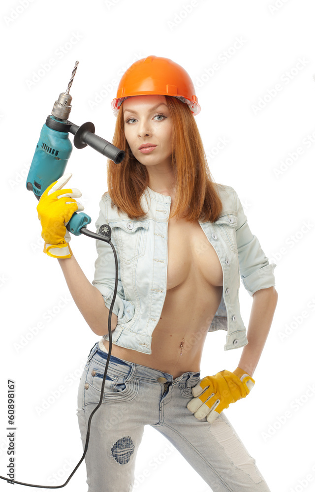 Girl with large breasts with an electric drill. Girl with large breasts with an electric drill.