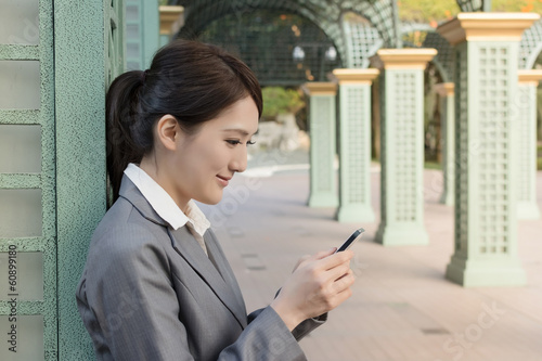 Attractive business woman use smart phone