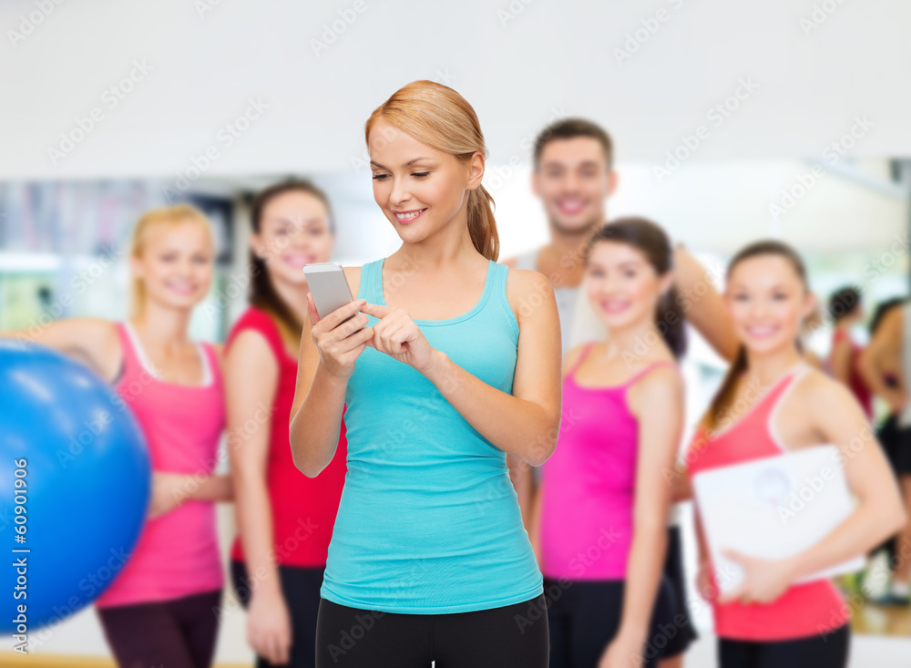 sporty woman with smartphone