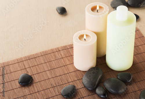 shampoo bottle  massage stones and candles