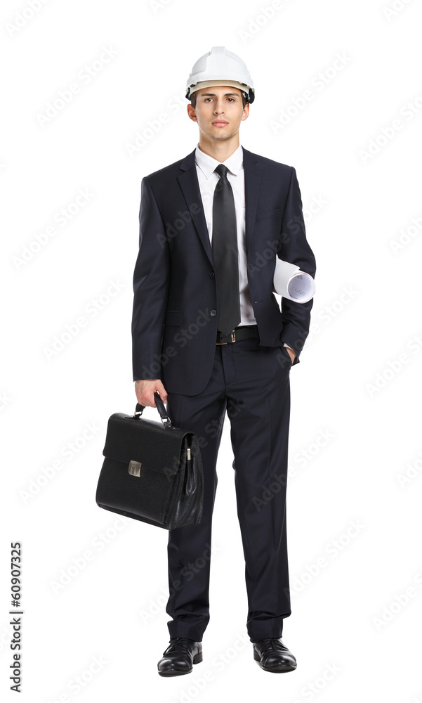 Full-length portrait of engineer in helmet handing layout Full-length portrait of engineer in helmet handing layout