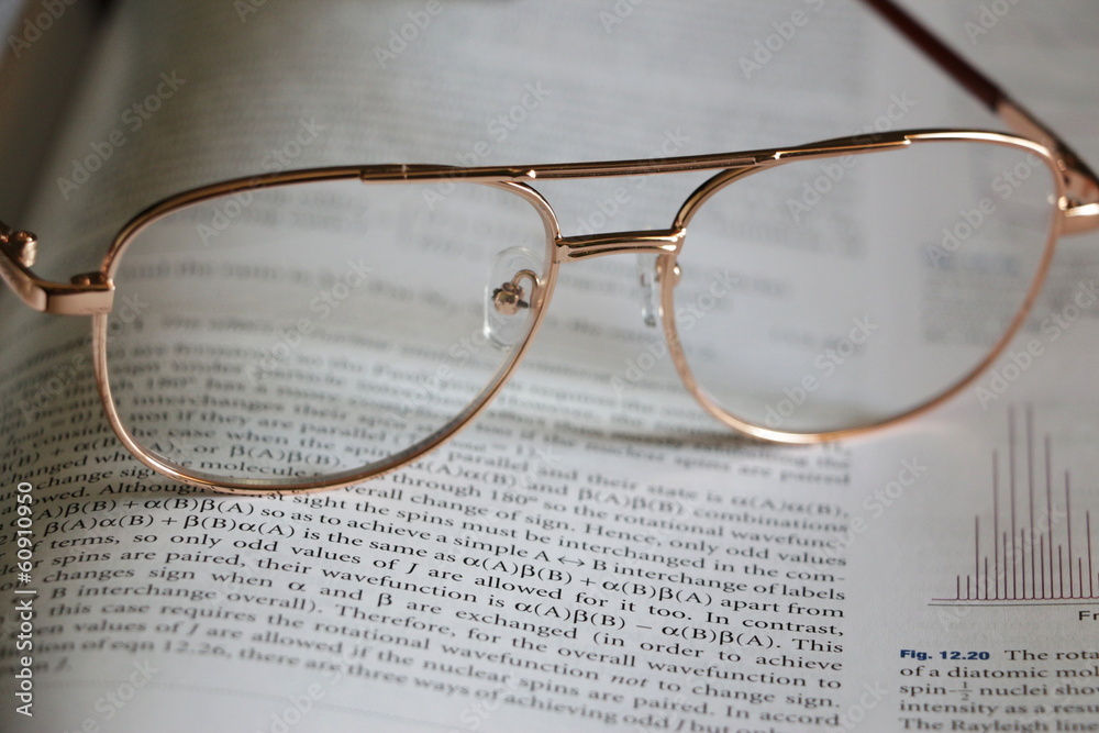 Glasses on a textbook