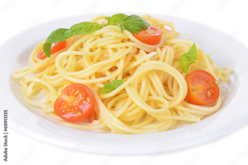 Delicious spaghetti with tomatoes on plate close-up Delicious spaghetti with tomatoes on plate close-up