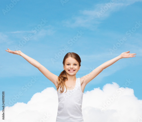 smiling teenage girl with raised hands