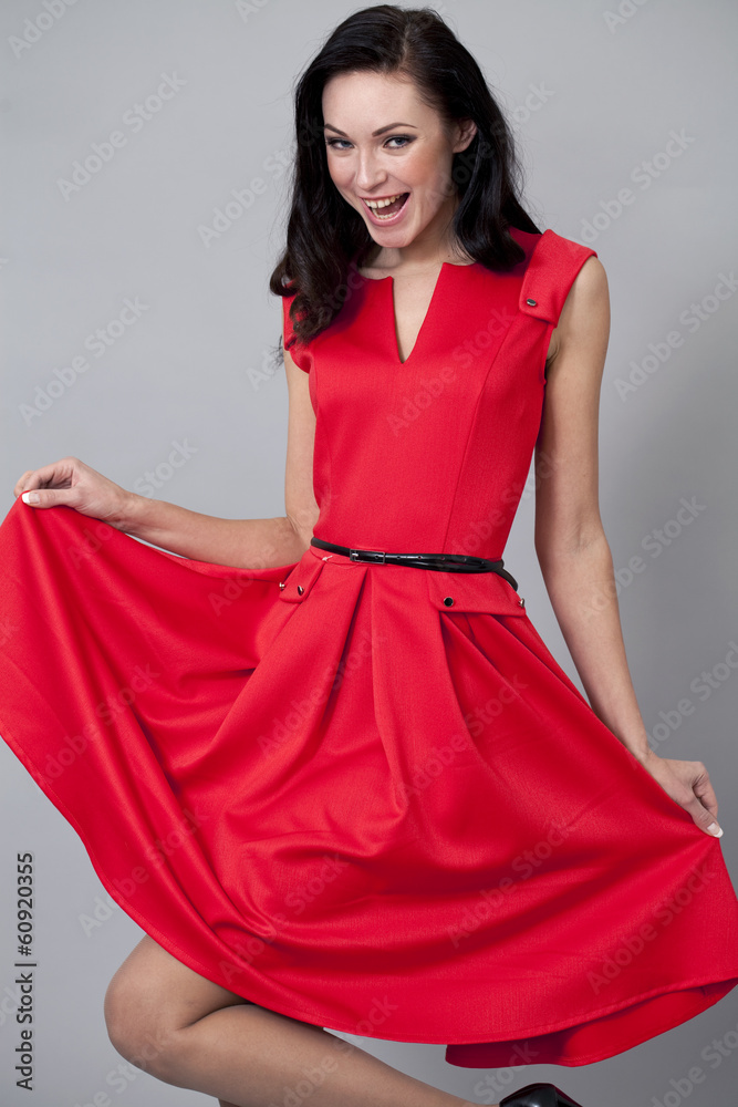 Fashion model in long red dress