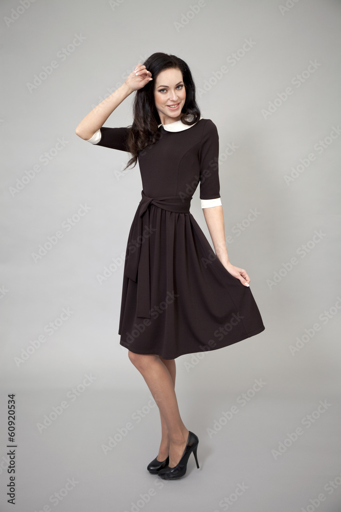 Beautiful professional model in dark brown dress Beautiful professional model in dark brown dress