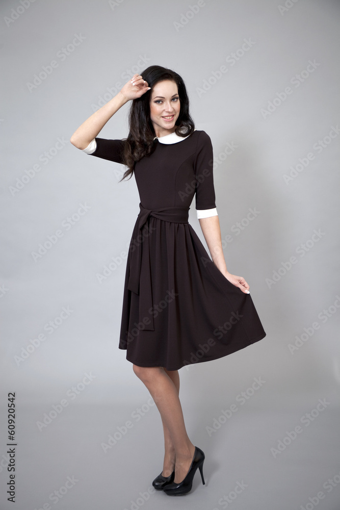 Fototapeta premium Beautiful professional model in dark brown dress