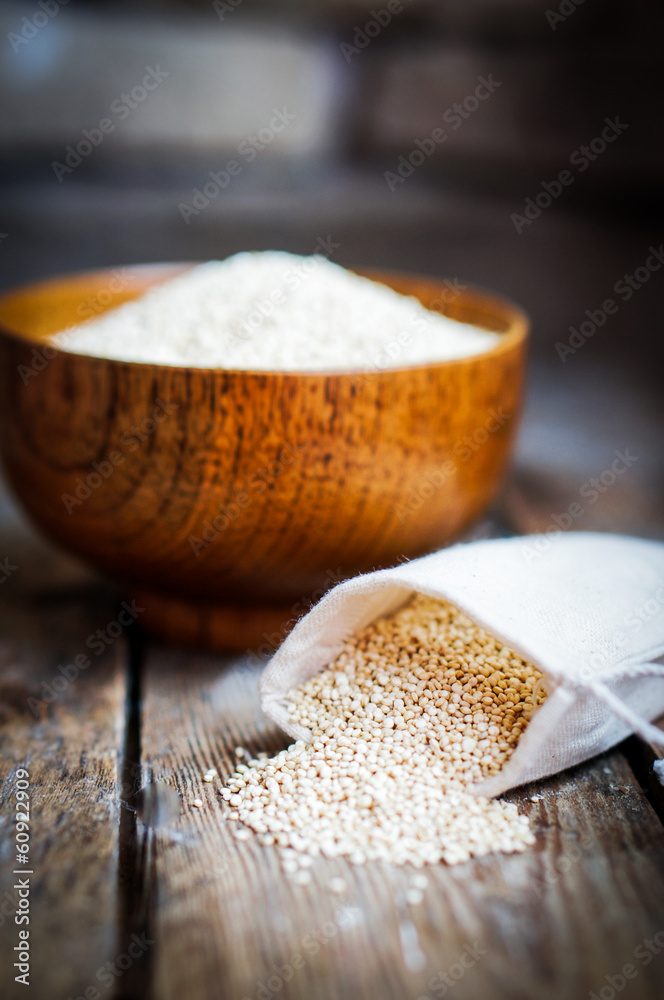 Fototapeta premium White quinoa on rustic wooden background