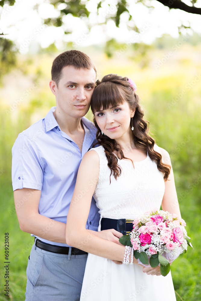 portrait of a man and woman standing on the background of green portrait of a man and woman standing on the background of green