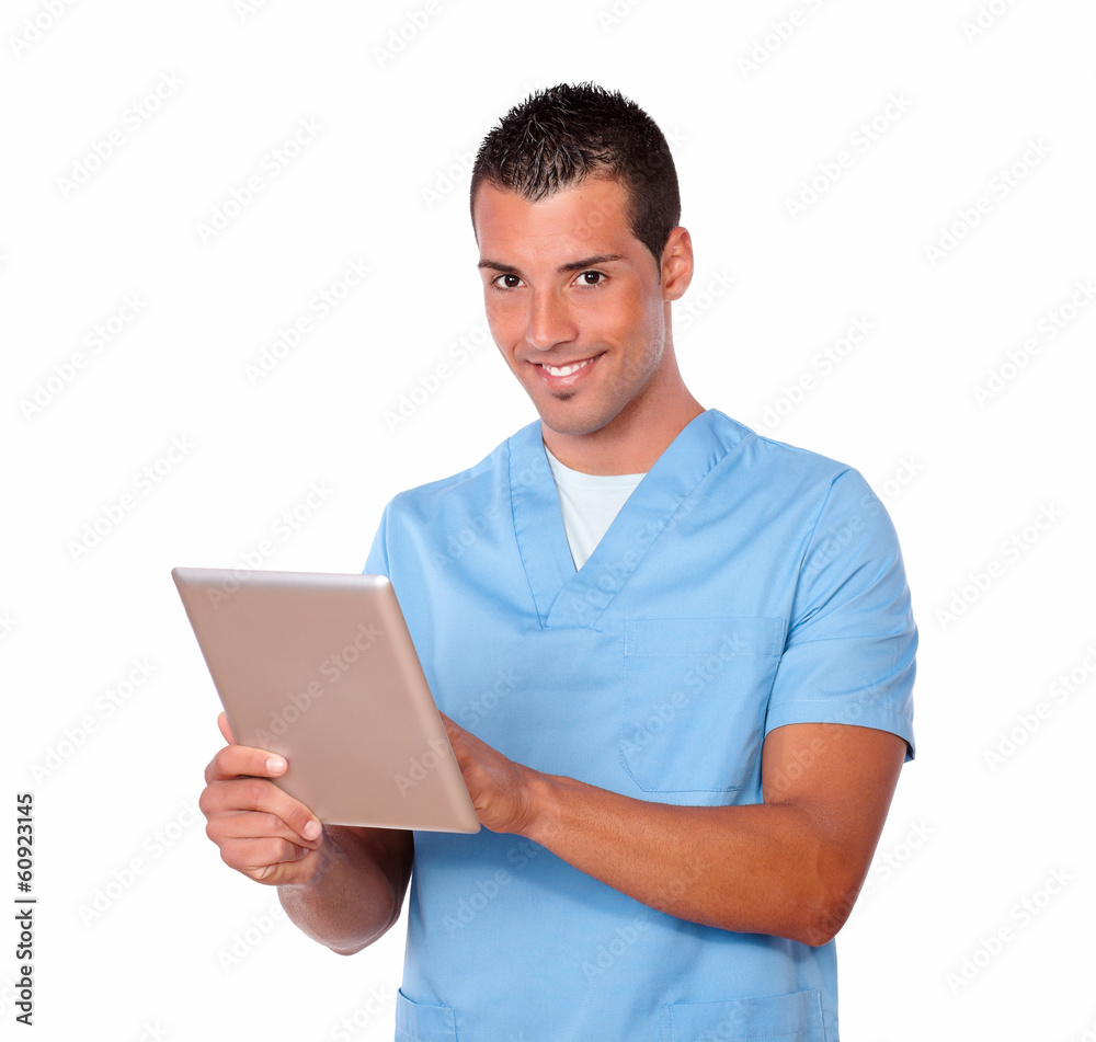 Handsome nurse man using his tablet pc Handsome nurse man using his tablet pc