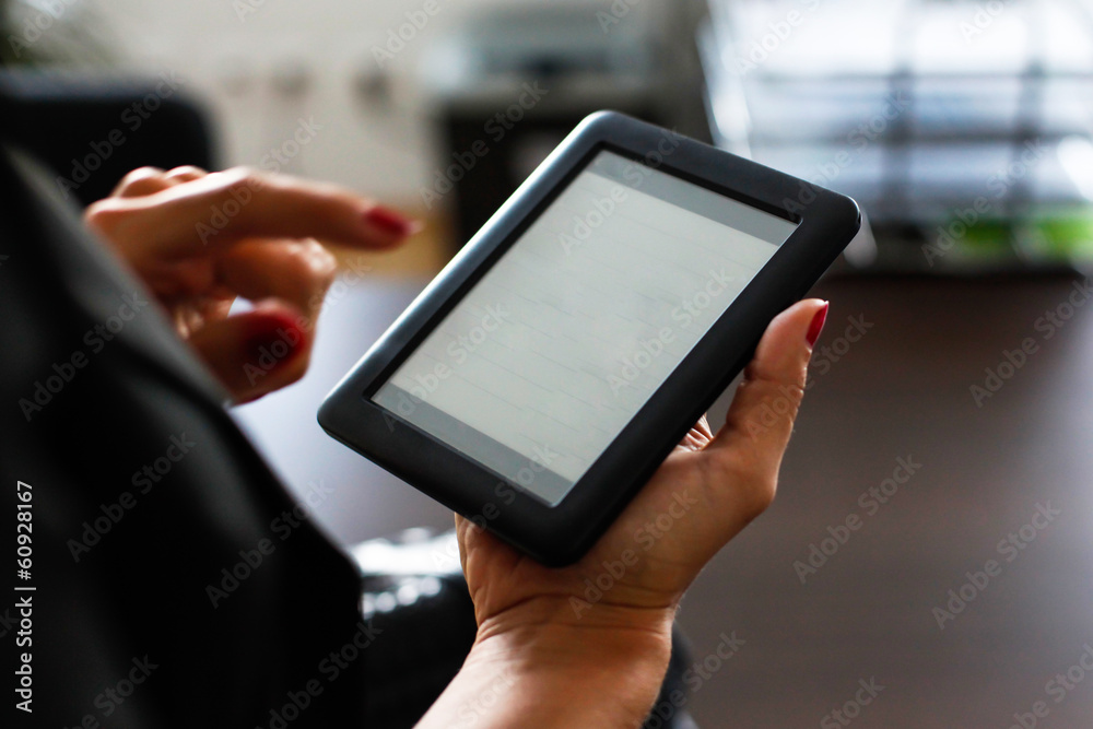 Woman holding a digital pad